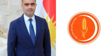 لۆگۆى كۆمه‌ڵى ئیسلامى كوردستان و سۆران عومه‌ر، ئه‌ندامى فراكسیۆنى كۆمه‌ڵ له‌ په‌رله‌مانى كوردستان | فۆتۆ: SNN
