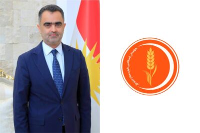 لۆگۆى كۆمه‌ڵى ئیسلامى كوردستان و سۆران عومه‌ر، ئه‌ندامى فراكسیۆنى كۆمه‌ڵ له‌ په‌رله‌مانى كوردستان | فۆتۆ: SNN